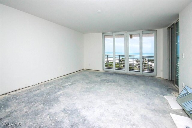 2959 W Gulf Dr Unit 204, Sanibel, FL 33957 - spare room with concrete flooring and a water view