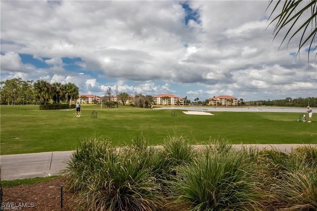 10520 Amiata Way Unit 303, Fort Myers, FL 33913 - surrounding community with a lawn, golf course view, and a water view