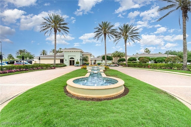 view of property's community with a yard