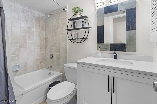 bathroom with vanity, shower / bath combo with shower curtain, and toilet