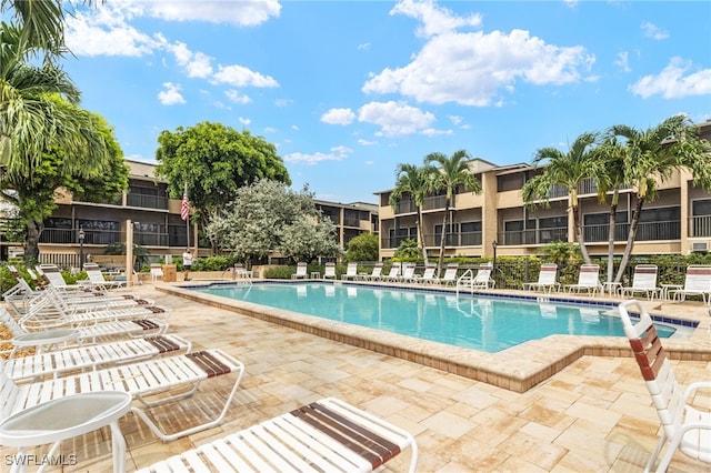 community pool with a patio area