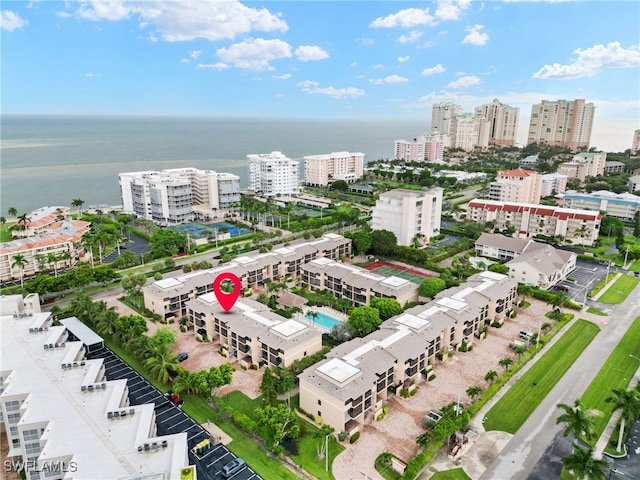 drone / aerial view featuring a city view and a water view