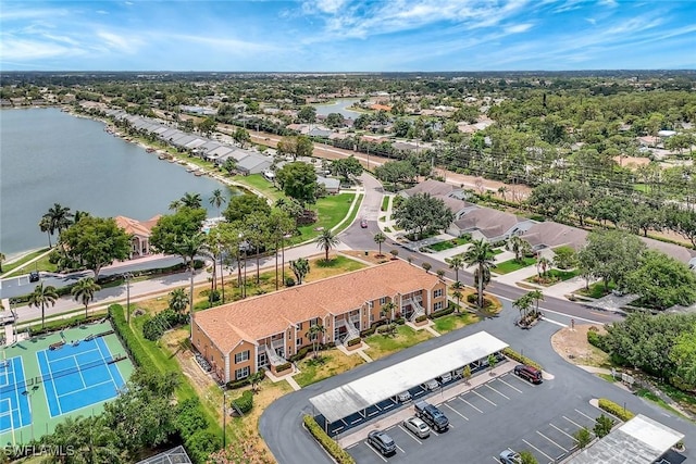 bird's eye view featuring a water view and a residential view