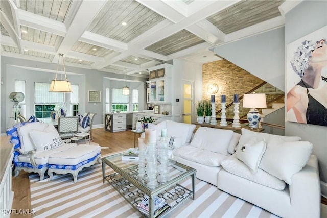 510 2nd St S Unit 102, Naples, FL 34102 - living area with beamed ceiling, coffered ceiling, wood finished floors, recessed lighting, and baseboards