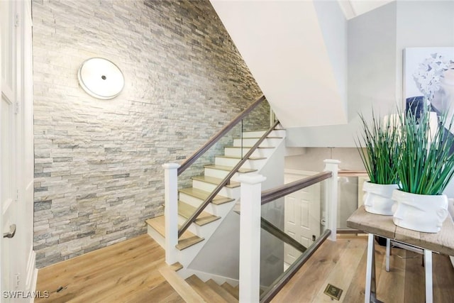 510 2nd St S Unit 102, Naples, FL 34102 - stairs with wood finished floors and a high ceiling