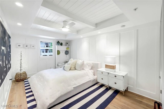 510 2nd St S Unit 102, Naples, FL 34102 - bedroom with a decorative wall, light wood-type flooring, a ceiling fan, recessed lighting, and wooden ceiling with exposed beams