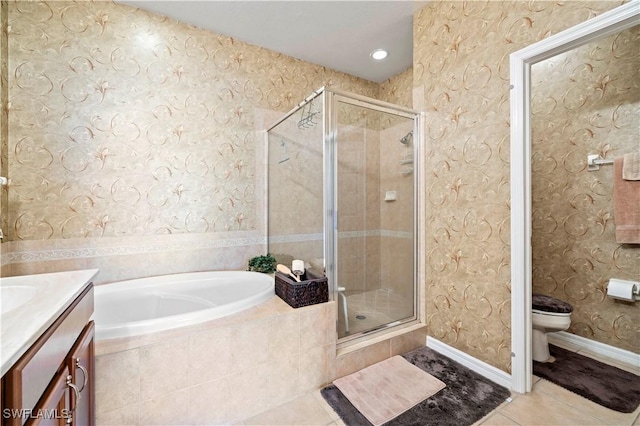 full bathroom featuring vanity, tile patterned floors, a garden tub, and a stall shower