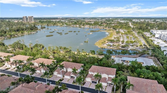 birds eye view of property featuring a water view and a residential view