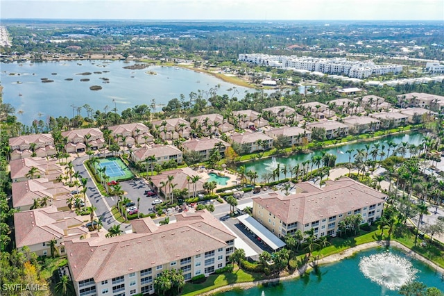 bird's eye view featuring a water view and a residential view