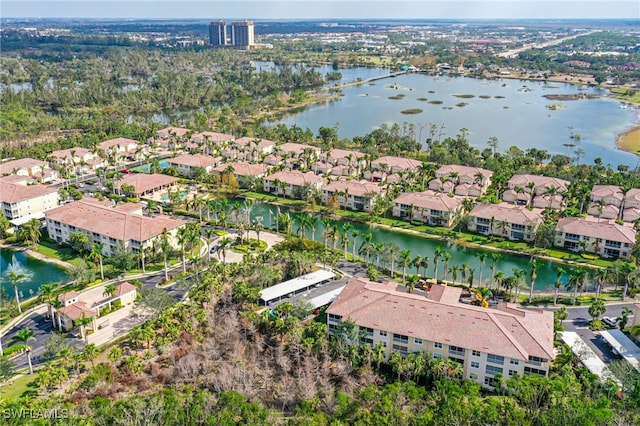 bird's eye view with a water view and a residential view