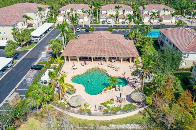 birds eye view of property with a residential view