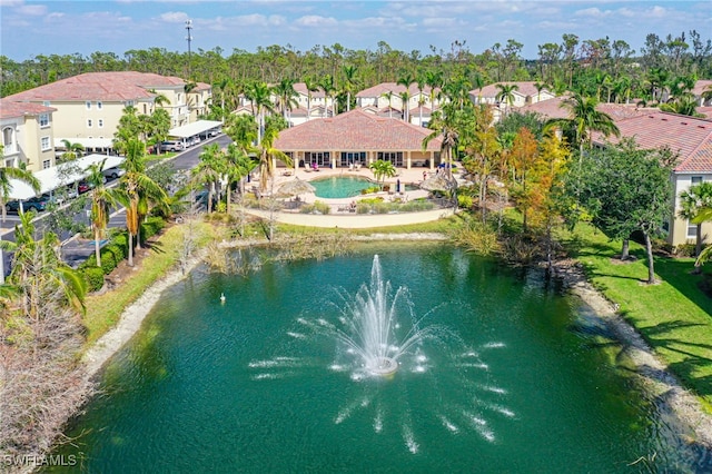 bird's eye view featuring a residential view and a water view