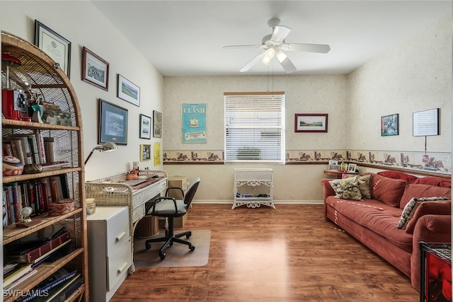 office space with baseboards, a ceiling fan, and wood finished floors