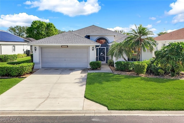 ranch-style house with roof with shingles, a garage, stucco siding, a front yard, and driveway