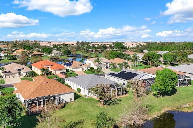 aerial view featuring a residential view and a water view