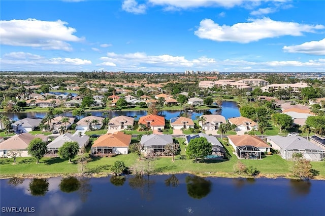 aerial view with a residential view and a water view