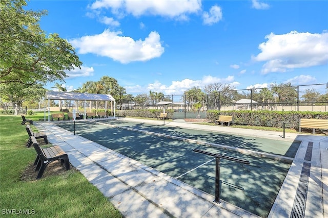 view of sport court with fence