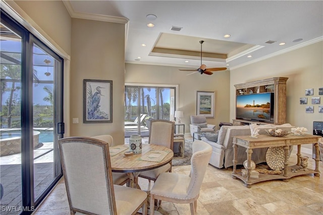 dining area featuring crown molding, a ceiling fan, recessed lighting, a tray ceiling, and visible vents