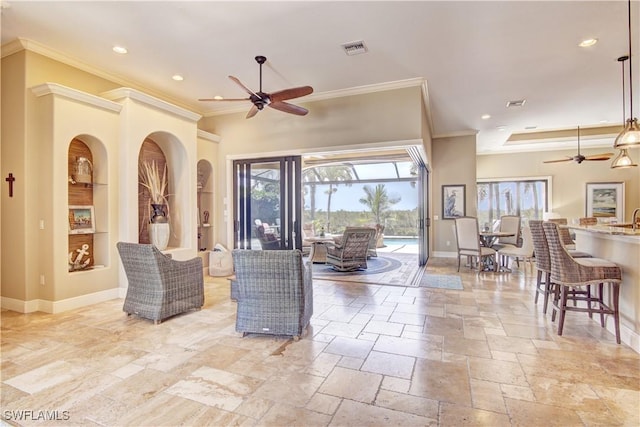 interior space featuring crown molding, a ceiling fan, built in features, and baseboards