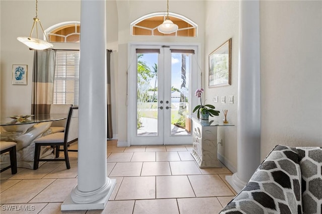 2536 SW 28th Pl, Cape Coral, FL 33914 - entryway featuring baseboards, decorative columns, a high ceiling, and french doors