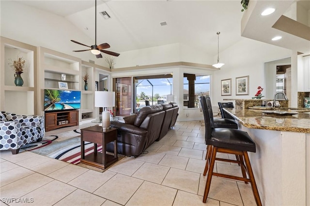 2536 SW 28th Pl, Cape Coral, FL 33914 - living room featuring visible vents, high vaulted ceiling, built in shelves, a ceiling fan, and light tile patterned floors