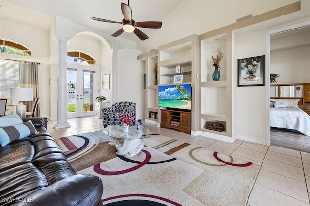 2536 SW 28th Pl, Cape Coral, FL 33914 - living area featuring ornate columns, tile patterned flooring, and built in shelves