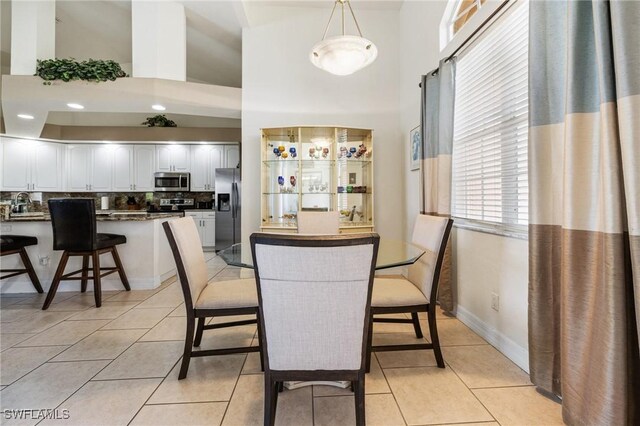 2536 SW 28th Pl, Cape Coral, FL 33914 - dining area featuring light tile patterned flooring and a towering ceiling