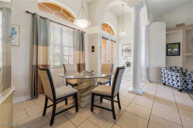 2536 SW 28th Pl, Cape Coral, FL 33914 - dining room with light tile patterned flooring, high vaulted ceiling, decorative columns, and baseboards