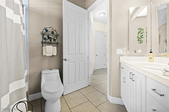 2536 SW 28th Pl, Cape Coral, FL 33914 - bathroom with vanity, baseboards, tile patterned floors, and toilet