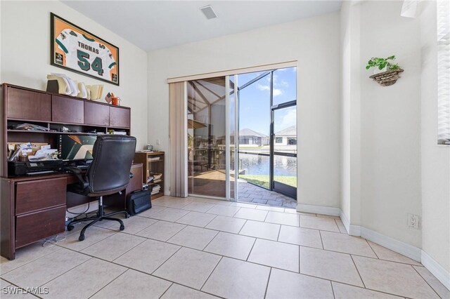 2536 SW 28th Pl, Cape Coral, FL 33914 - office area featuring a water view, baseboards, visible vents, and light tile patterned floors