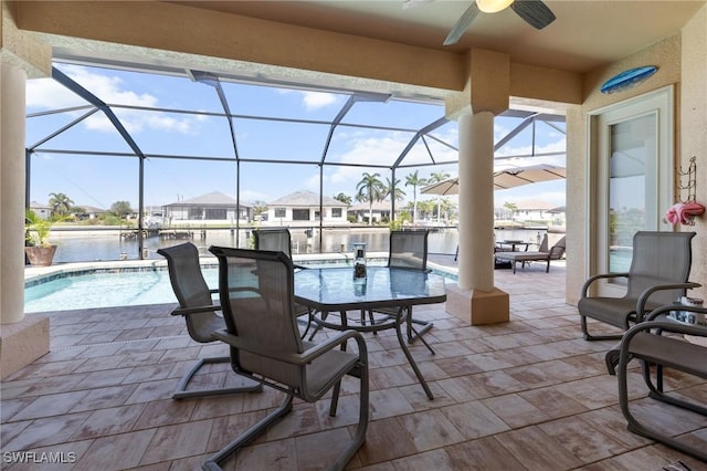 2536 SW 28th Pl, Cape Coral, FL 33914 - view of patio / terrace featuring a ceiling fan, glass enclosure, a water view, and an outdoor pool