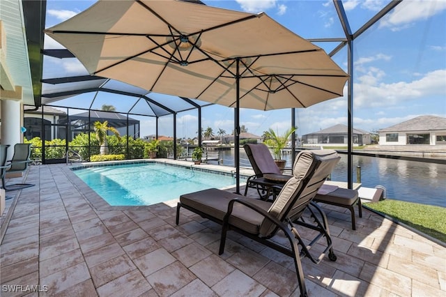 2536 SW 28th Pl, Cape Coral, FL 33914 - outdoor pool featuring a patio, a water view, and glass enclosure