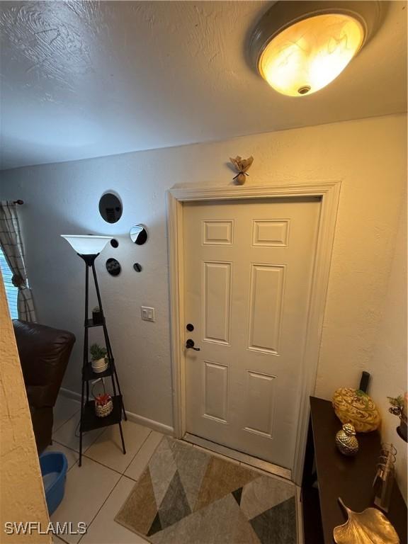 interior space with light tile patterned floors