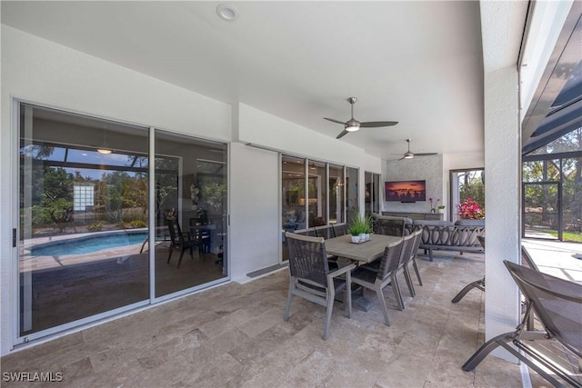 view of patio / terrace featuring outdoor dining area and ceiling fan