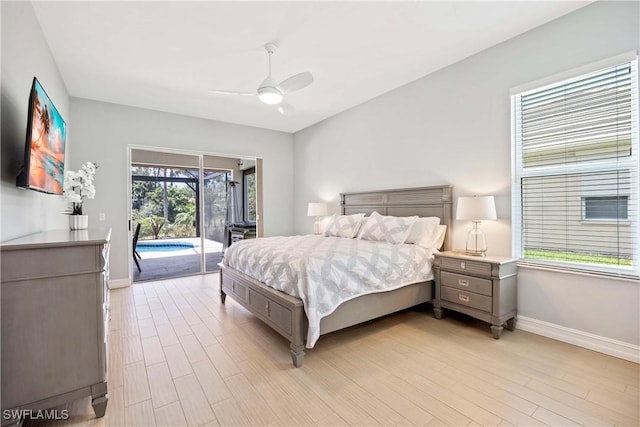 bedroom featuring access to exterior, baseboards, light wood-type flooring, and a ceiling fan