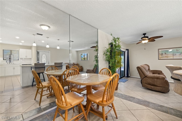 7136 Blanquilla Ct, Fort Myers, FL 33908 - dining space featuring light tile patterned floors, ceiling fan, a textured ceiling, and recessed lighting