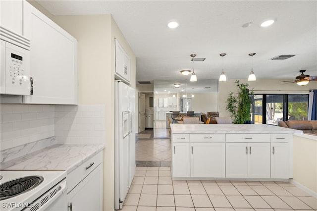 7136 Blanquilla Ct, Fort Myers, FL 33908 - kitchen with open floor plan, white appliances, light tile patterned flooring, decorative backsplash, and recessed lighting
