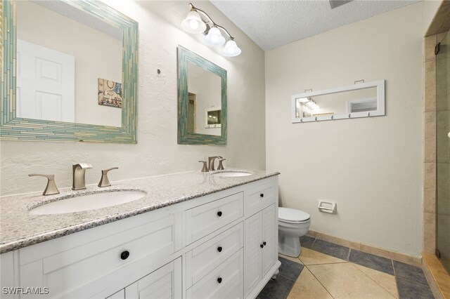 7136 Blanquilla Ct, Fort Myers, FL 33908 - full bath with toilet, double vanity, a textured ceiling, tile patterned floors, and a shower