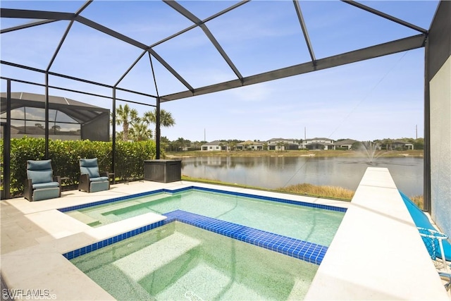 view of swimming pool featuring a water view, a pool with connected hot tub, a lanai, and a patio