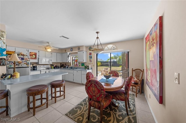 dining room featuring light tile patterned floors