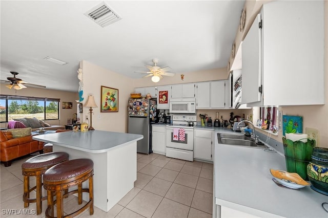 kitchen with white appliances, ceiling fan, a sink, and light tile patterned floors