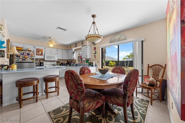 dining space with light tile patterned floors