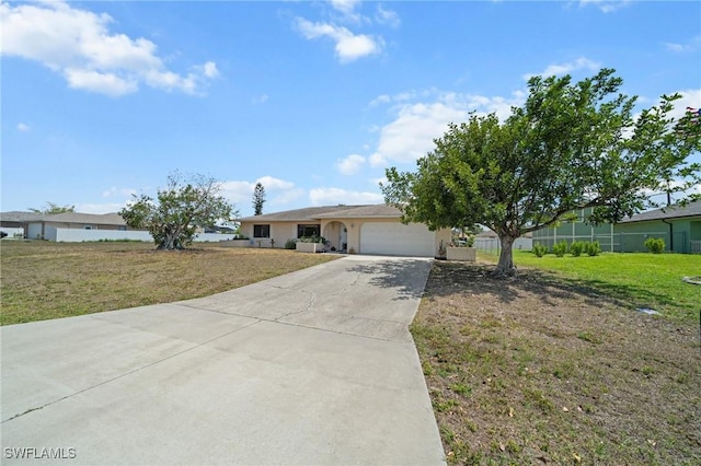 ranch-style house featuring an attached garage, concrete driveway, a front yard, and stucco siding