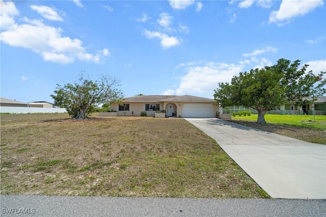 ranch-style house featuring an attached garage, driveway, stucco siding, and a front yard