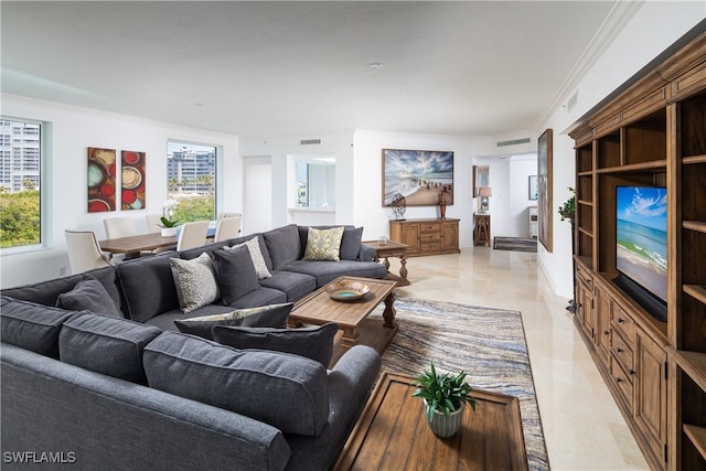 living area featuring visible vents, crown molding, and plenty of natural light