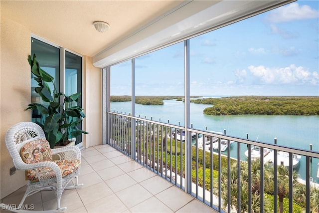 balcony featuring a water view