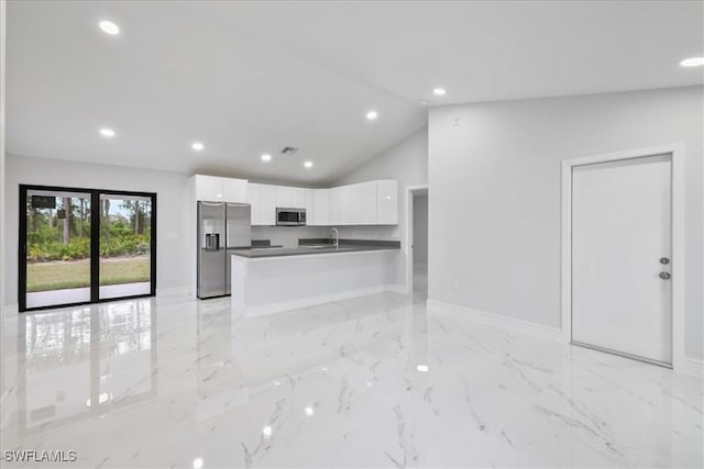 631 Summit Ave S, Lehigh Acres, FL 33974 - kitchen featuring appliances with stainless steel finishes, a sink, white cabinets, dark countertops, and baseboards