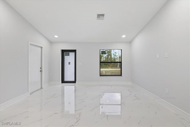 631 Summit Ave S, Lehigh Acres, FL 33974 - empty room featuring marble tiled flooring, recessed lighting, and baseboards