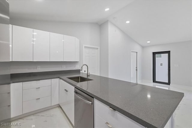 631 Summit Ave S, Lehigh Acres, FL 33974 - kitchen with stainless steel dishwasher, a sink, lofted ceiling, modern cabinets, and light marble finish floors