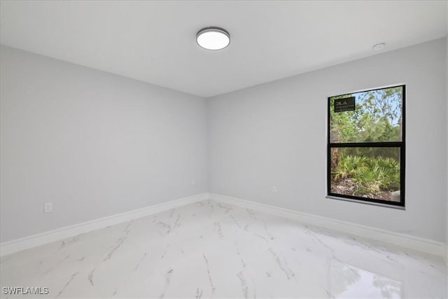 631 Summit Ave S, Lehigh Acres, FL 33974 - unfurnished room featuring marble finish floors and baseboards